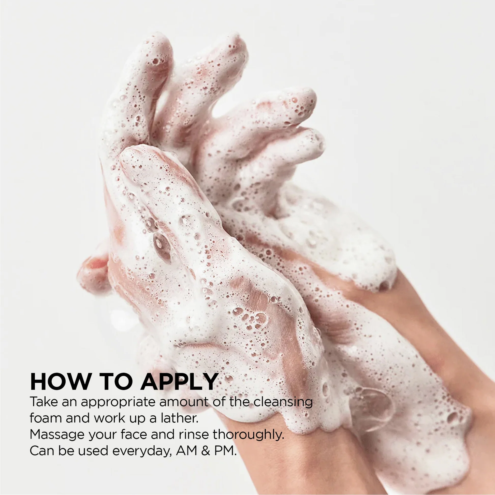 Anua Heartleaf Succinic Moisture Cleansing Foam — tube with water splash lifestyle hero